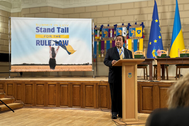 Harold Hongju Koh speaking in front of a screen for the Stand Tall for the Rule of Law conference