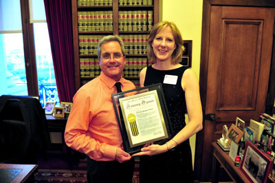 San Francisco City Attorney Dennis Herrera standing with Professor Heather Gerken with both holding a plaque
