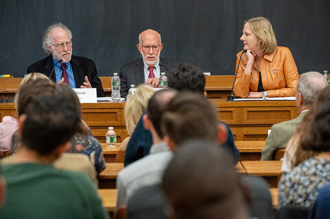 Bob Bauer, Ben Ginsberg and Heather Gerken seated at the front of a classroom talking to an audience