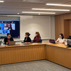 Panelists and audience members at an event on disability law