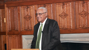 Clifford Alexander Jr at a lectern in the Yale Law faculty lounge